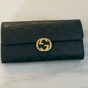 Gucci Black Leather Wallet with Gold Emblem